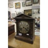 A 20th Century oak cased mantel clock