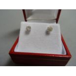 Pair of 14ct white gold diamond stud earrings of ¾ of a carat
