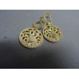 Pair of silver gilt and CZ earrings in the Cartier style depicting a tiger's face with emera;d eyes