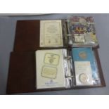 Two Pobjoy Mint collectors albums of proof coins to include Crowns