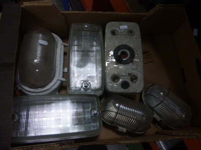 Six industrial wall lights and three amp meteres.