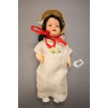 Bisque headed composition doll with teeth & blue eyes, marked Dollies Britain 2 to back of head,