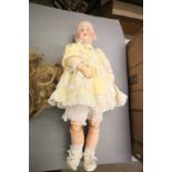 German bisque headed jointed composition doll marked RC 25 6 Germany to back of head, blue