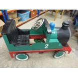 Vintage tin plate pedal car in the form of a train