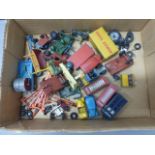 Group of vintage Dinky diecast model vehicles and roadside accessories featuring trailers, telephone