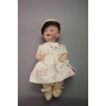 Mengersgereuth Porzellanfabrik bisque headed composition doll, marked PM 914 3 to back of head,