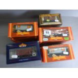 19 Boxed OO gauge trucks and wagons to include Hornby R715 Shell Tank Wagon x 5, R235 45 Ton GLW