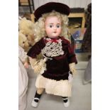 Bisque headed jointed composition doll with teeth & blue eyes marked 3 to back of the head, paint