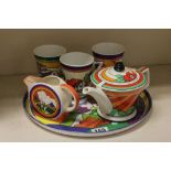 Five items of Clarice Cliff style Ceramics on similar plastic tray