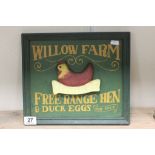 A contempory wooden sign Willow Farm free range eggs .