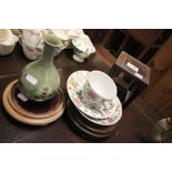 Four pieces of Oriental ceramics and three hardwood pot stands