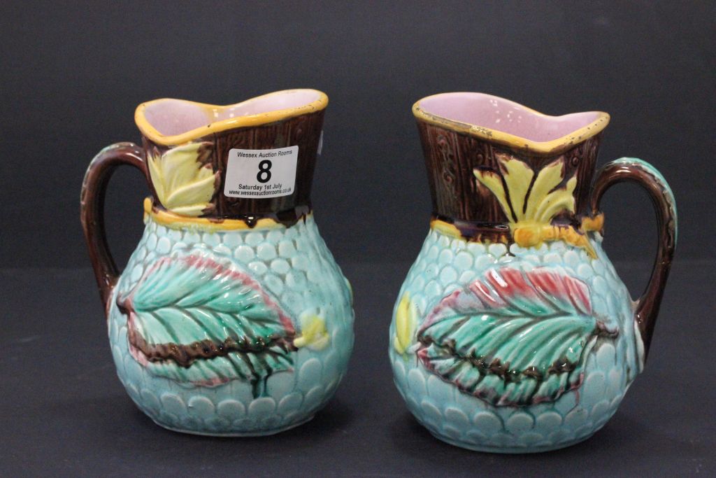 Pair of 19th century Majolica jugs with date lozenges to base