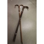 Four vintage walking sticks with silver collars
