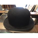 A Moores vintage bowler hat.