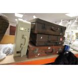 Three vintage leather suitcases, plus one other