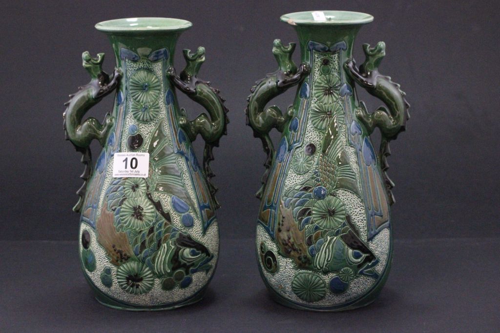 Pair of Brannam Barum vases RD 44561 with Fish design and Dragon handles