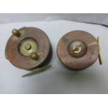 Two vintage wooden star back fishing reels