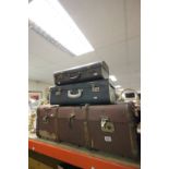 A trunk and two vintage suitcases