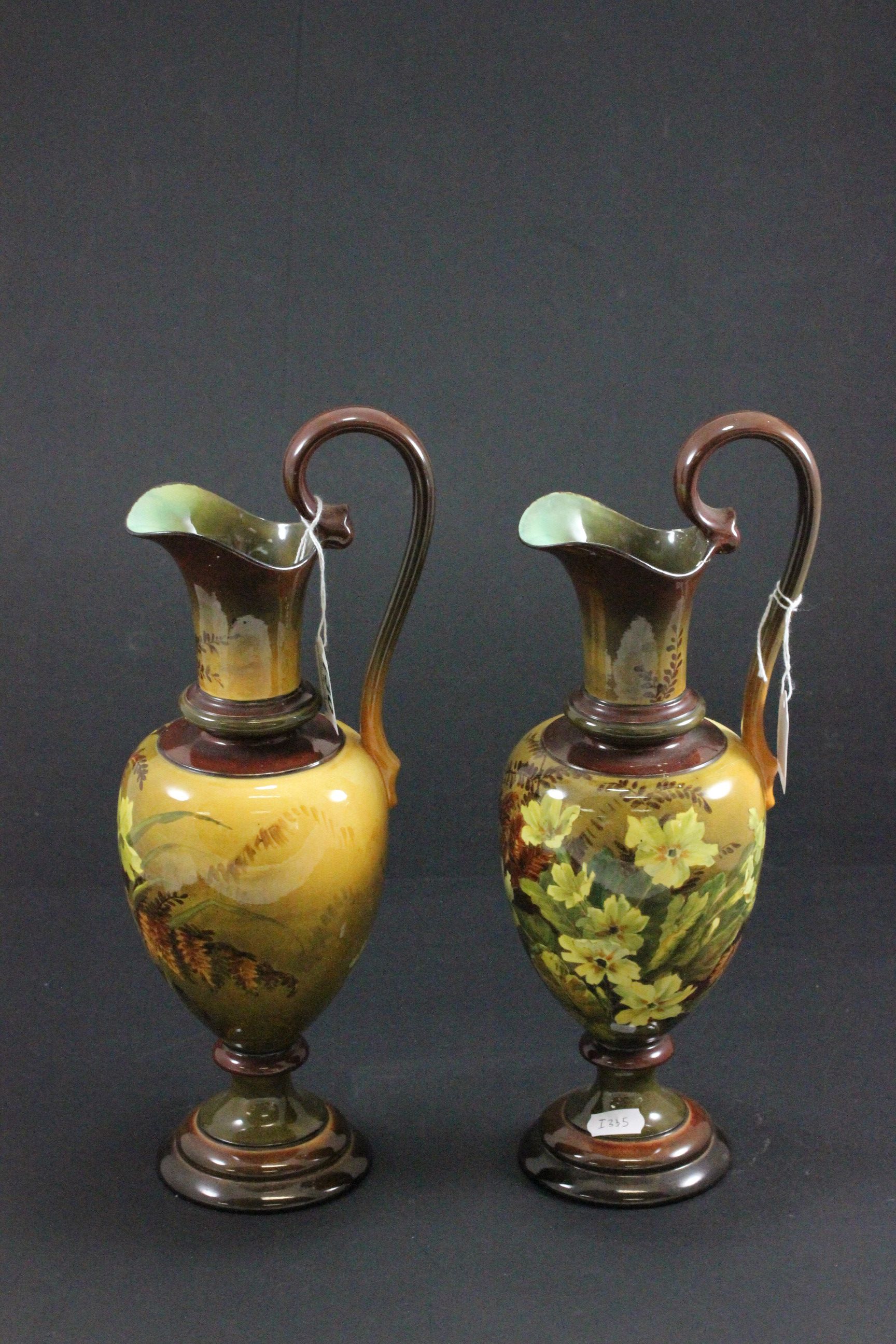 A pair or Royal Doulton ewers