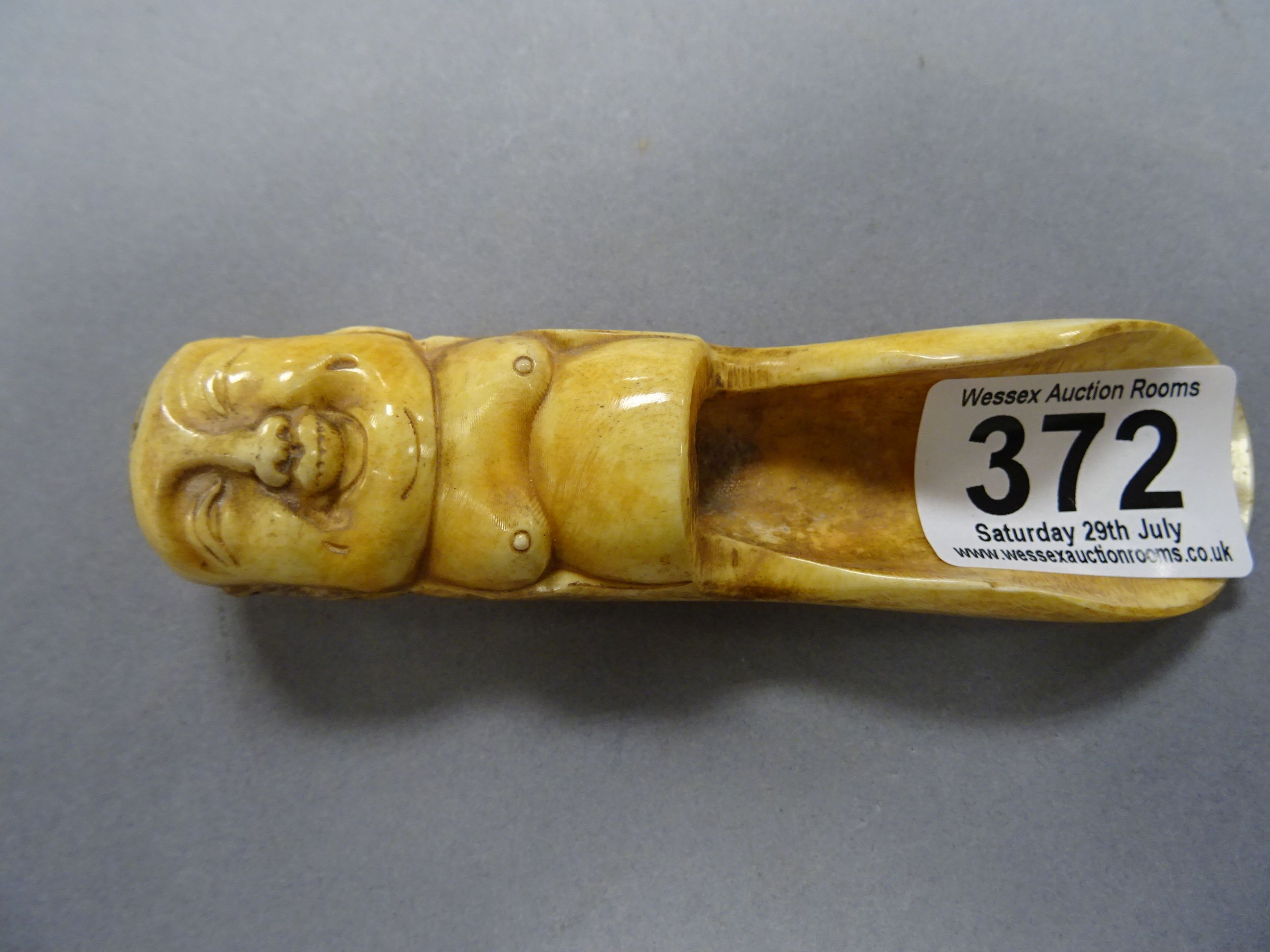 Bone scoop spoon / apple corer with Buddha to handle