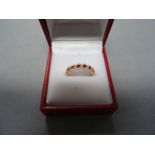 18ct rose gold, ruby and diamond half eternity ring, 75 points total weight