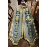 Pair wooden backed frames with cast metal erotic figures and planters painted gilt and bluey green