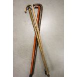 Silver Handled Walking Stick and Three Other Walking Sticks