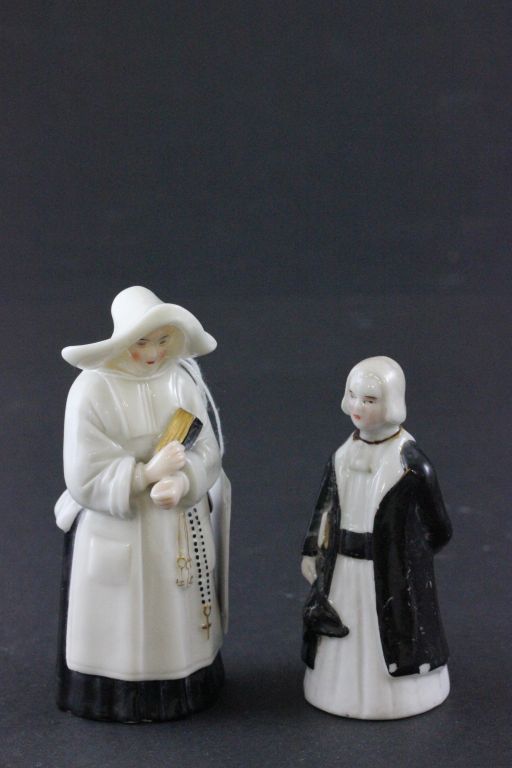 Two ceramic candle snuffers to include a Worcester nun