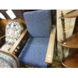 An oak fireside armchair
