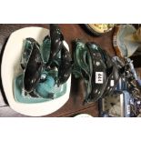 Five Poole Pottery Dolphins together with a Dolphin Pin Dish and a Seal plus Three Ironstone Steak