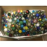 Collection of marbles containing various colours and sizes