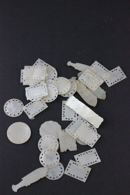 Collection of mother of pearl Gaming counters with pierced & engraved Oriental decoration