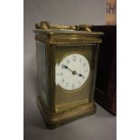 19th century Gilt Brass Travelling Carriage Clock, the white enamel dial with Blue and Black