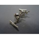 A pair of silver elephant shaped cufflinks