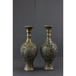 Pair of bronze Oriental vases decorated with figurative panels signed to base