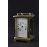 A brass carriage clock retailed by Jays, 442-444 Oxford St