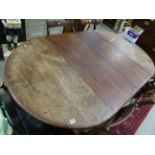 Mid 19th century Mahogany Dining table on fluted legs and castors with two additional leaves