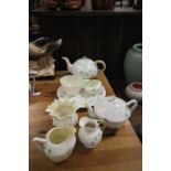 Group of Belleek Shamrock Teaware including Two Teapots, Two Milk Jugs, Three Sugar Bowls and