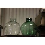 Clear Glass Carboy Jar and a Green Glass Carboy Jar