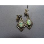 A pair of silver and opal drop earrings