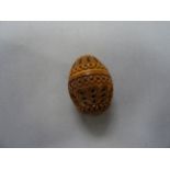 Treen coquilla nut thimble case/nutmeg holder with screw top and carved decoration
