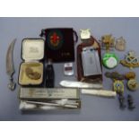 Mixed lot comprising Military Cap Badges, Carved Bone Cheroot, Lighter, Mizpah Brooch, Lead Figures,