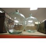 Two large glass carboys