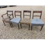A set of four mahogany 19th century style rail back dining chairs.