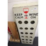 A wooden painted wine rack keep calm and wine on, together with a rustic wine rack.