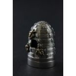 An unusual silver pincushion in the form of a bee hive