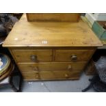 A small Victorian pine chest of two short and two long drawers