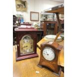 Two vintage clocks to include a German example