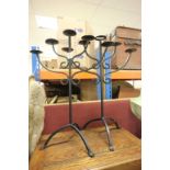 Two black painted 5 pricket candle holders