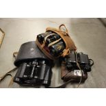 Three vintage cased pairs of binoculars to include military, fournier and Russian